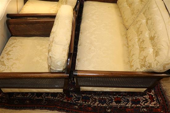 A mahogany and double canework bergere suite Sofa W.145cm